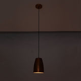 Hudson Hammered Copper Bell Pendant Light illuminated with warm downward lighting for ambient interiors.