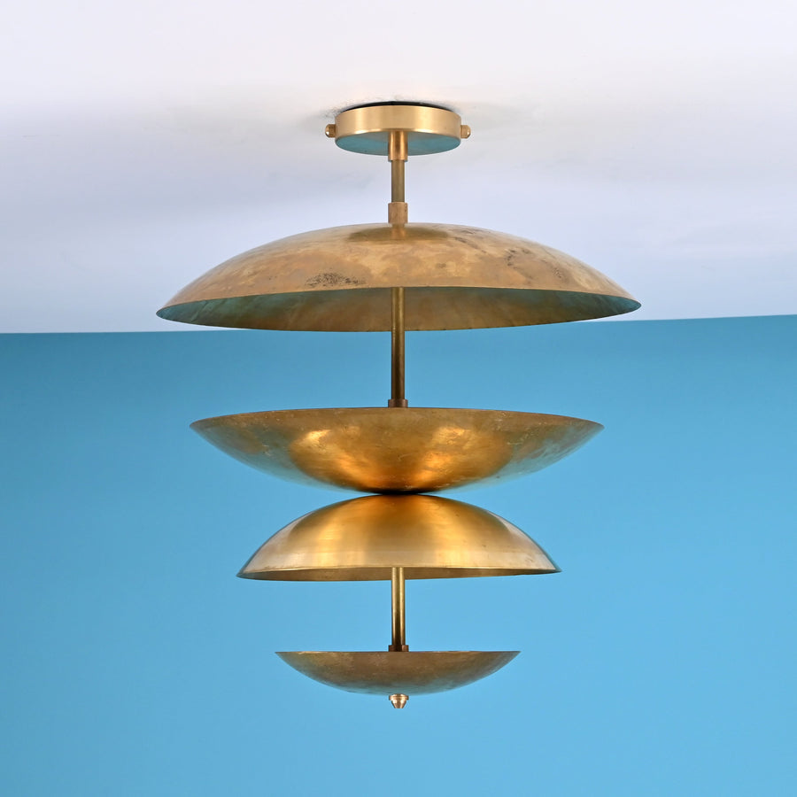 Layered brass disc flush mount ceiling light with sculpted bowl shades, handcrafted in solid brass with warm indirect ambient lighting.