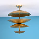 Layered disc brass flush mount ceiling light with sculpted bowl shades, handcrafted in solid brass for warm ambient indirect lighting.