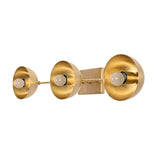 Linear brass wall sconce with three evenly spaced dome shades for bedroom, hallway, and vanity areas
