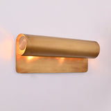 Closeup of Brass Patina linear wall sconce showing cylindrical shield and warm inner lighting
