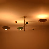 Low profile three light brass flush mount ceiling light ideal for modern interiors and low ceilings