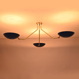Luxury handcrafted brass flush mount ceiling light casting a warm evening glow across the ceiling