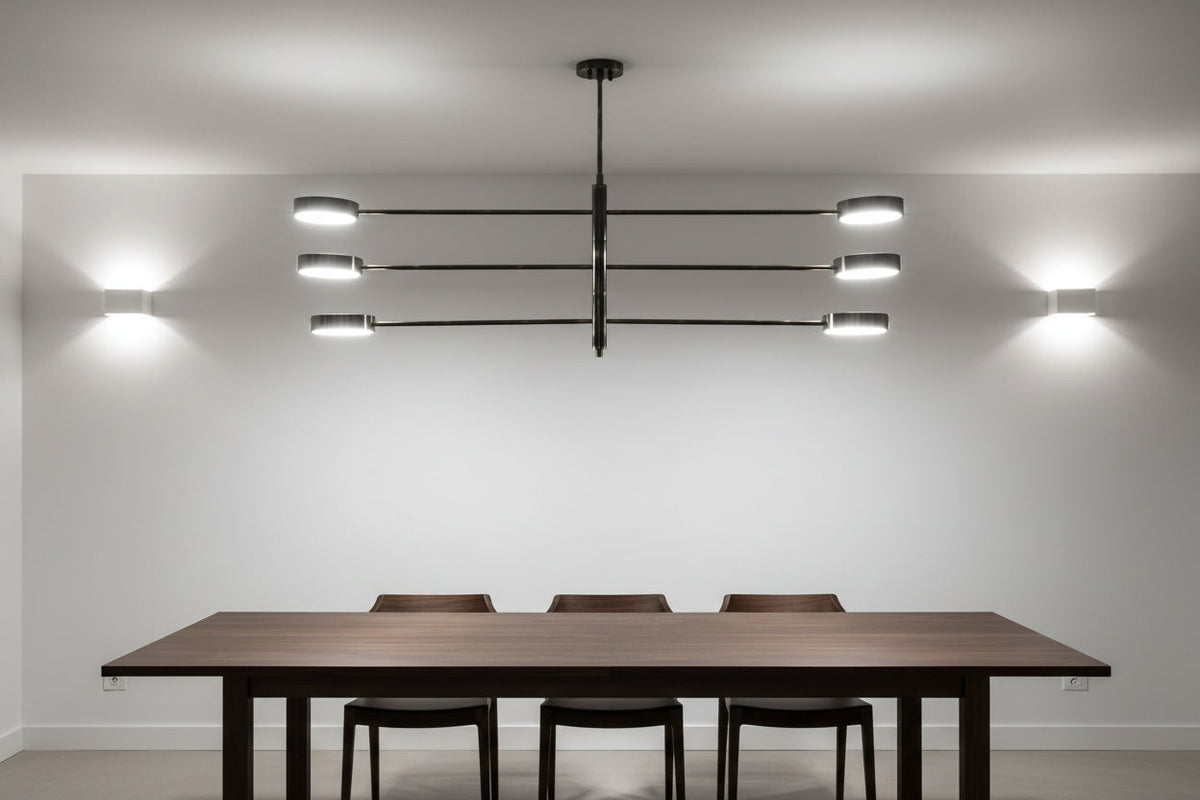 Madrid linear LED ceiling fixture featuring a solid brass frame, long horizontal arms, and modern round light heads