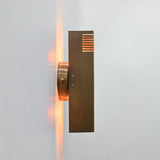 Marbella brass wall sconce front view featuring a clean rectangular body, round backplate, and brass patina finish