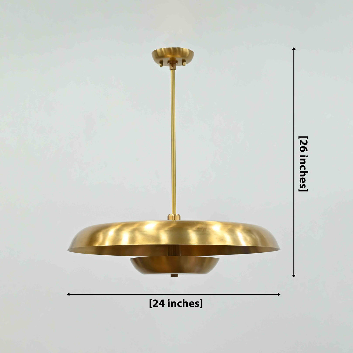Marseille 2-tier solid brass disc chandelier with wide 24 inch shade and warm ambient glow by Brass Leaf Studio