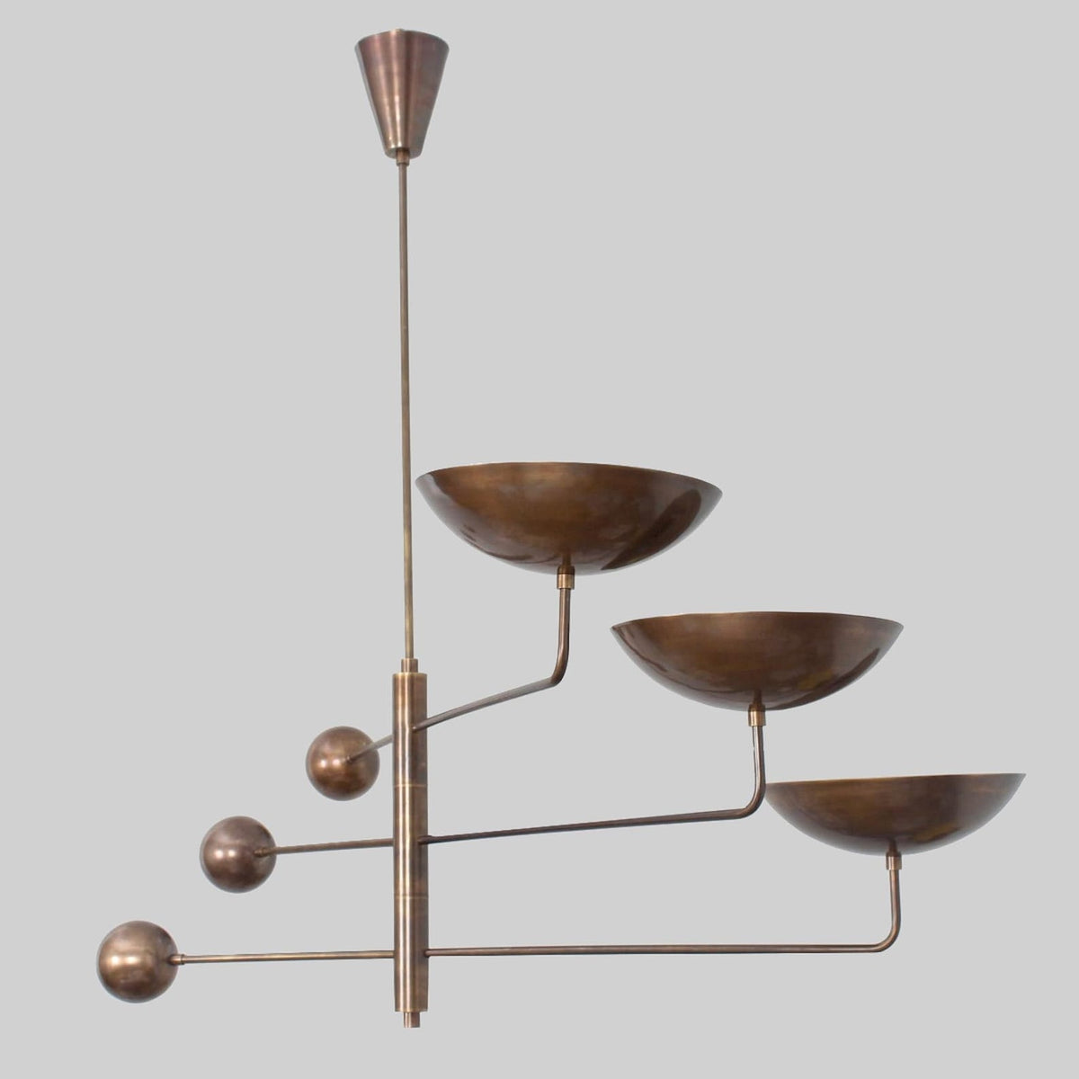 Vintage-inspired brass chandelier with blackened bronze finish and minimalist mid-century structure
