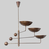 Vintage-inspired brass chandelier with blackened bronze finish and minimalist mid-century structure