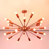 Ceiling view of mid century modern brass sputnik chandelier with evenly spaced illuminated arms.