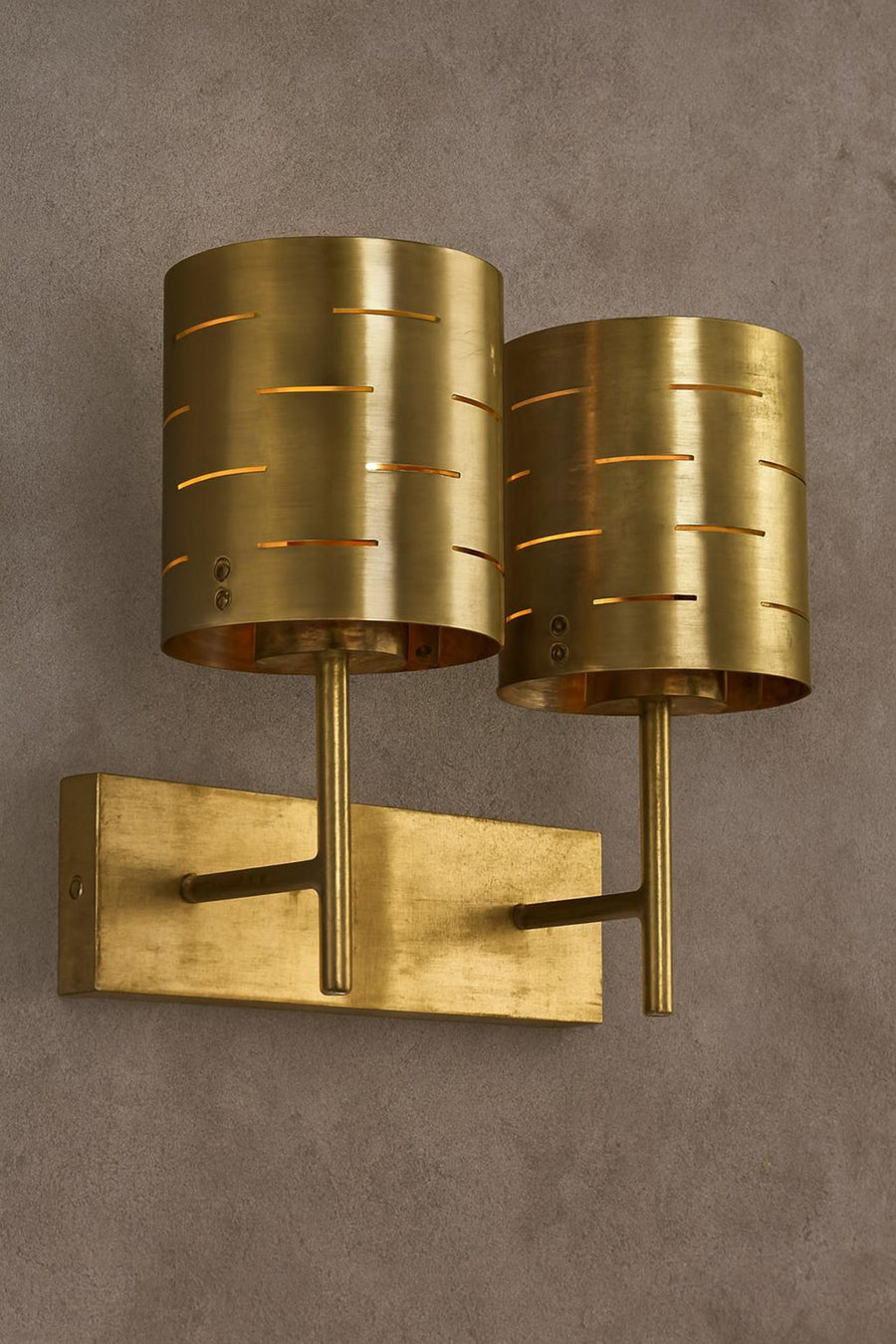 Brushed brass dual wall sconce with two cylindrical perforated shades, mid-century modern industrial wall light fixture