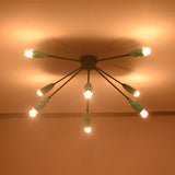 Mid-century orbit chandelier illuminated at night highlighting balanced radial design