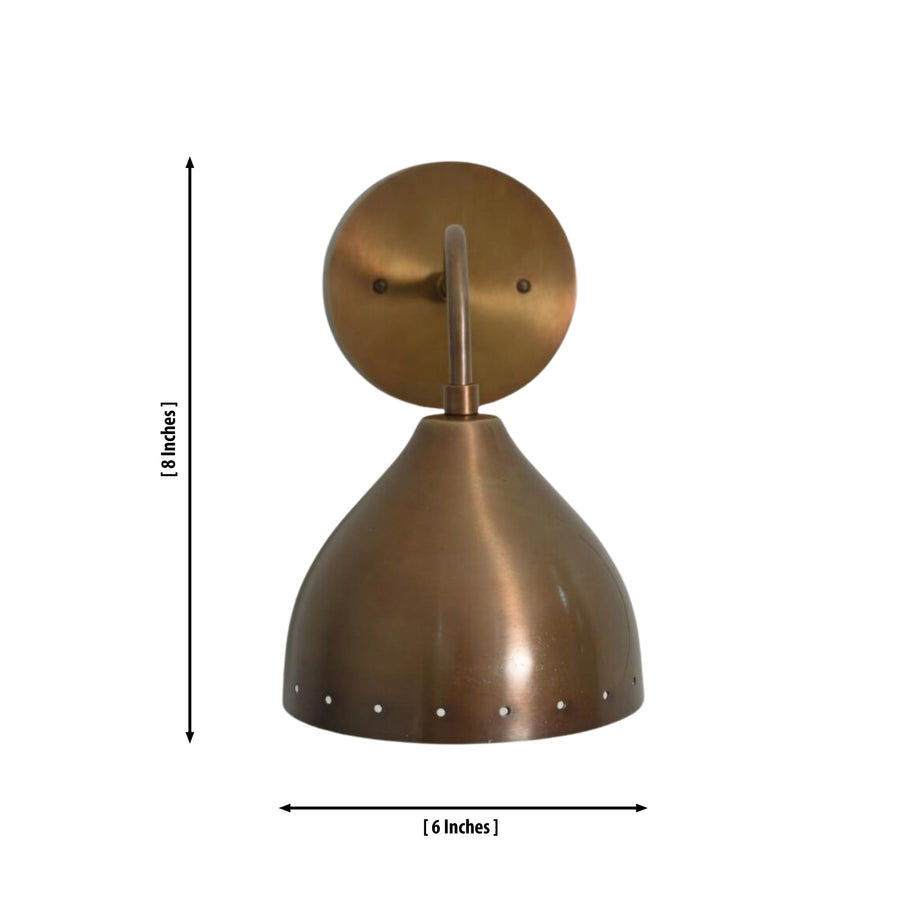 Milan perforated dome wall sconce installed above console table in warm modern interior – Model 32749