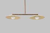 Bottom view of minimalist brass disc chandelier showcasing dual glass globe lighting design