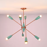 Bottom view of mint green brass chandelier highlighting radial arm layout and warm light distribution.