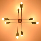 Underside detail of mint green brass sputnik chandelier showcasing handcrafted structure and warm light.