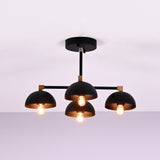 Modern 4 light brass bowl flush mount ceiling light with matte black finish and warm ambient glow by Brass Leaf Studio.