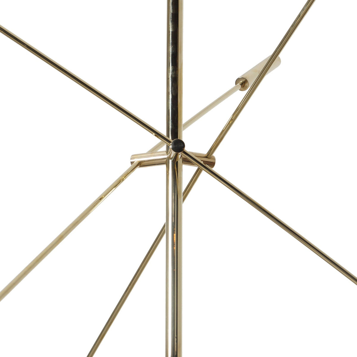 Close-up detail of polished brass joints and structure from handcrafted 3-arm chandelier by Brass Leaf Studio