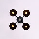 Top view of modern brass bowl ceiling light highlighting cross arm structure and minimalist industrial design.