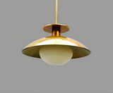 Modern brass bowl pendant light with glass globe diffuser, minimalist industrial ceiling fixture in brushed brass