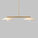 Modern brass disc chandelier featuring twin glass globes and clean horizontal silhouette