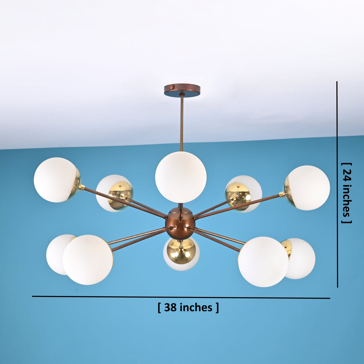 Modern brass globe chandelier with 10 lights showing 38 inch width and 24 inch height in a symmetrical radiating arm design.