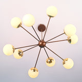 Handcrafted modern brass chandelier with opal glass globes and radiating arms providing warm ambient lighting.