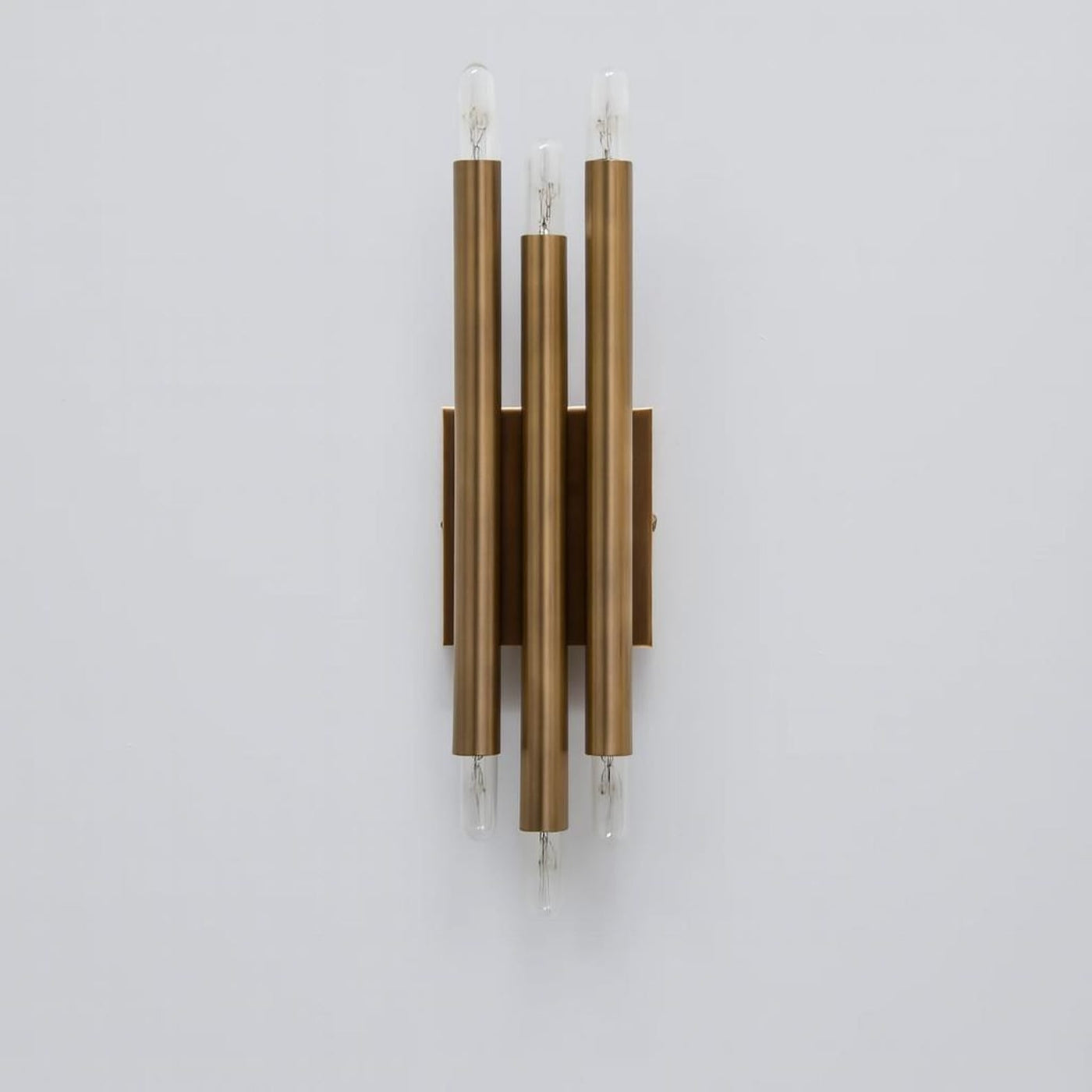 Handcrafted modern brass vertical wall lamp with six exposed E26 bulbs and symmetrical tube design