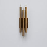 Handcrafted modern brass vertical wall lamp with six exposed E26 bulbs and symmetrical tube design
