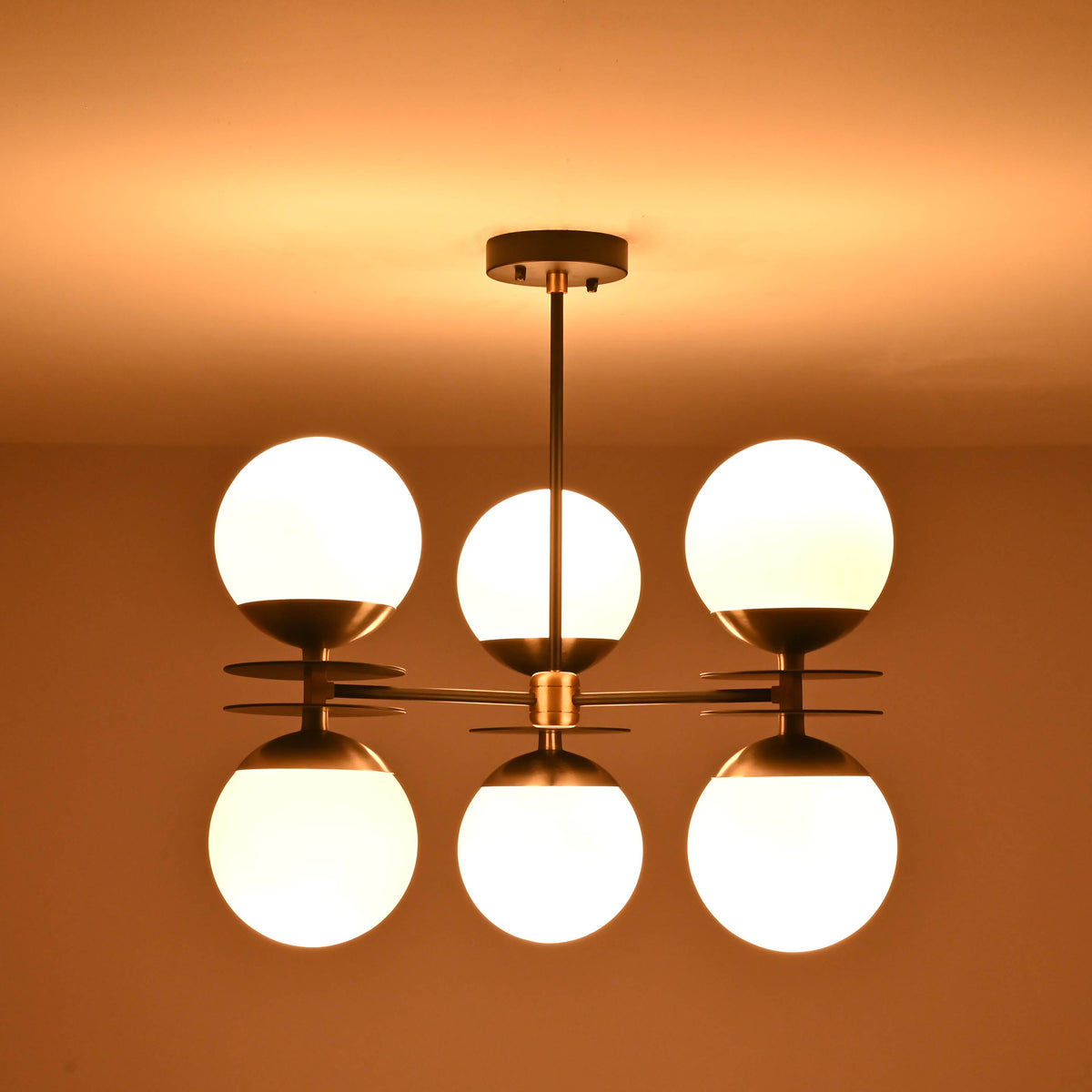Modern opal glass globe chandelier designed for even ambient light distribution