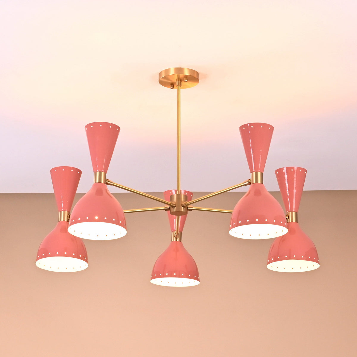Ceiling-mounted peach double cone light fixture in brass finish for modern interiors