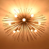 Modern starburst brass ceiling light providing even radial glow across the ceiling surface