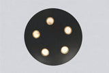 Bottom view of orbit disc chandelier highlighting circular black brass plate and five brass-trimmed light openings.