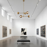 Orion Orbit 6 Light Brass Globe Chandelier with two-tier branching arms – straight view