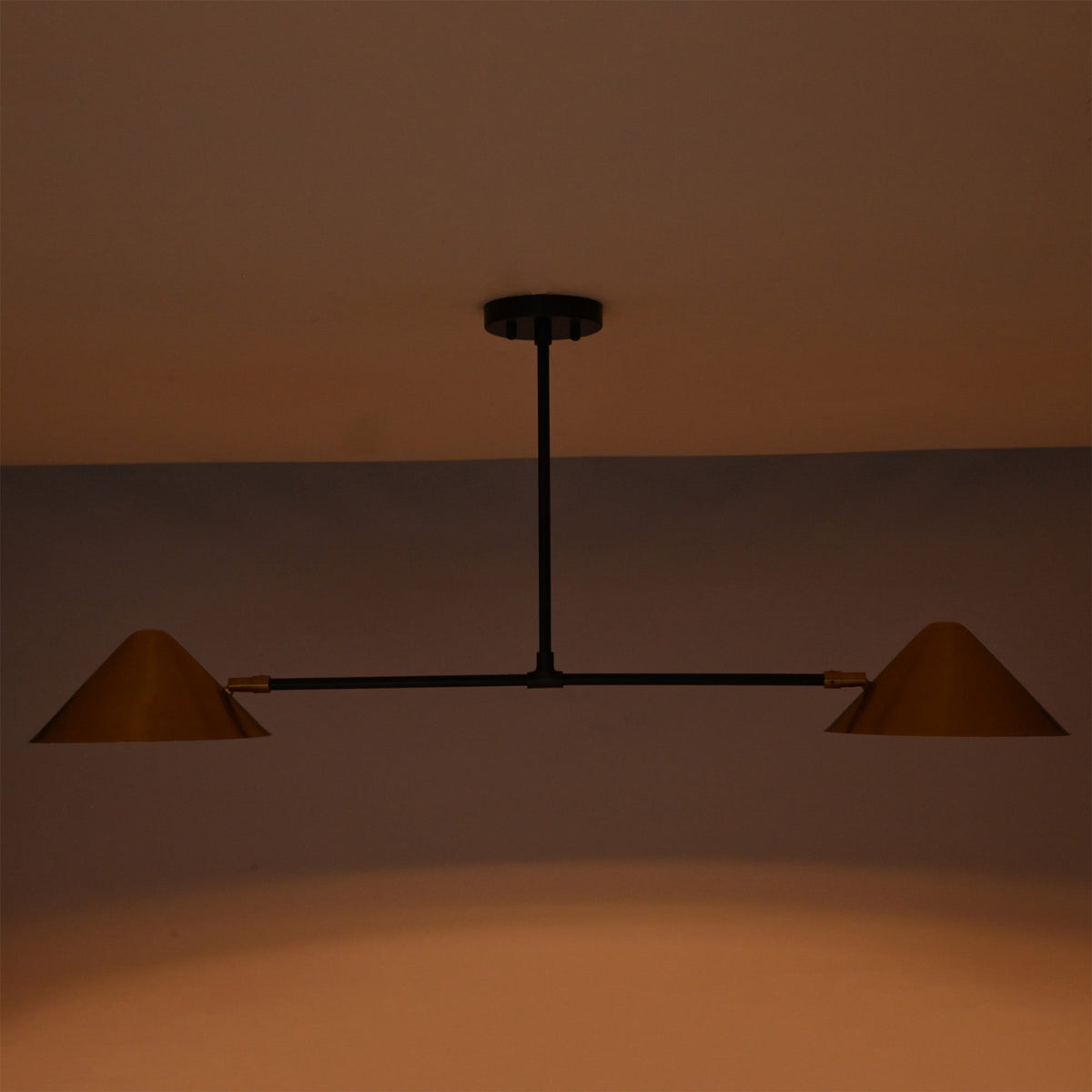 Oslo Modern Double Cone Linear Chandelier providing soft downward ambient lighting