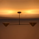 Oslo Modern Double Cone Linear Chandelier creating warm indirect ceiling illumination