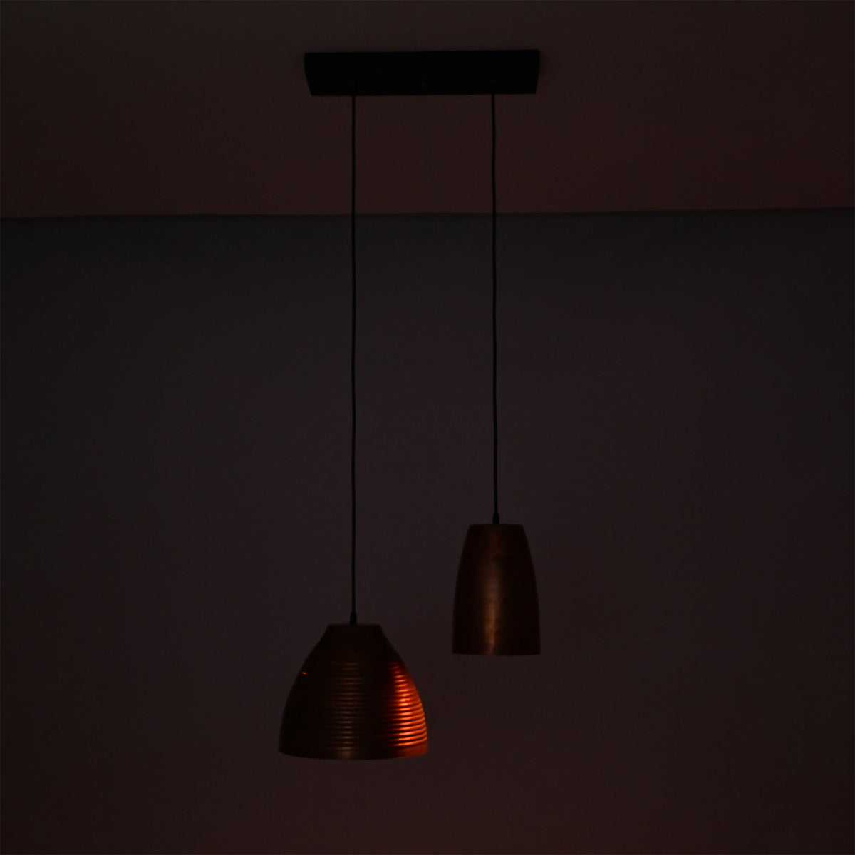 Decorative Oslo Modern Dual Copper Pendant Chandelier casting warm focused illumination from handcrafted copper shades