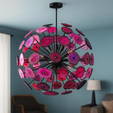 Pink agate stone chandelier with black metal frame creating dramatic contrast in a contemporary interior