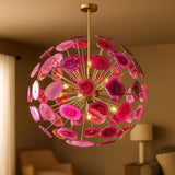Pink agate stone chandelier with brushed brass frame glowing warmly in an elegant interior setting