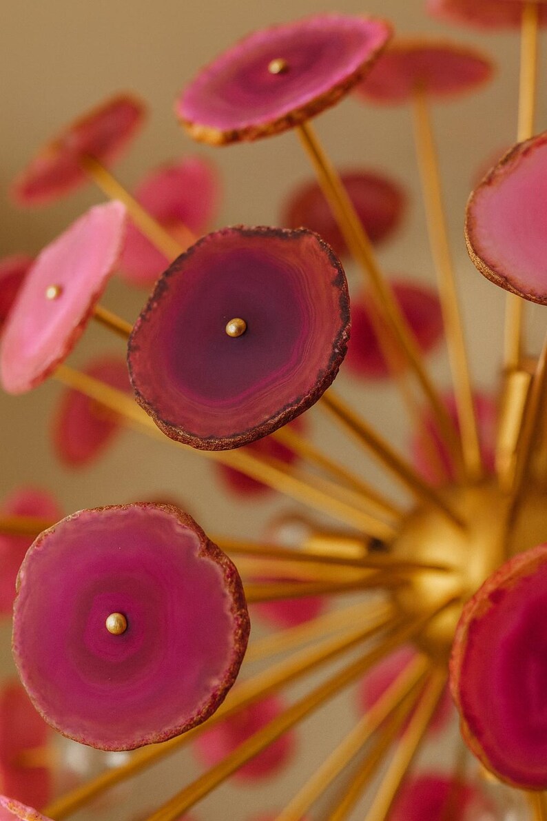 Macro view of natural pink agate stone slice highlighting organic texture and translucent layers