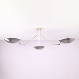 Polished chrome 3 light semi flush mount ceiling light with brass bowl shades, modern minimalist design by Brass Leaf Studio.