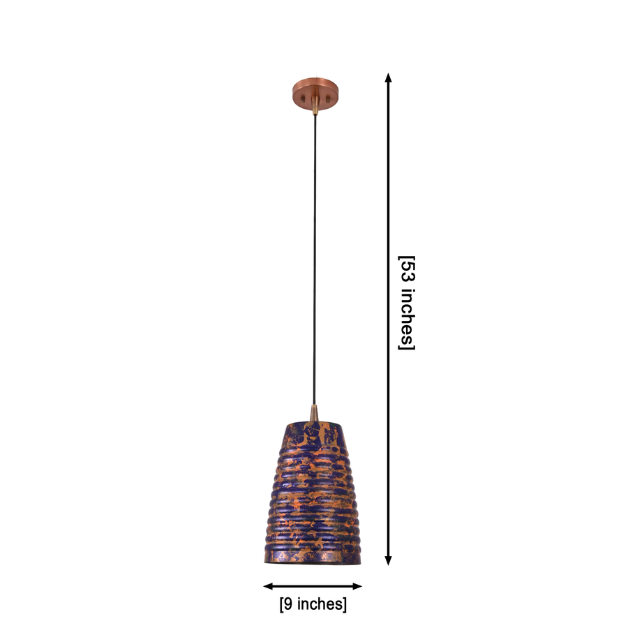 Blue patina ribbed pendant light hanging above a dining table with warm downward glow for cozy home interiors