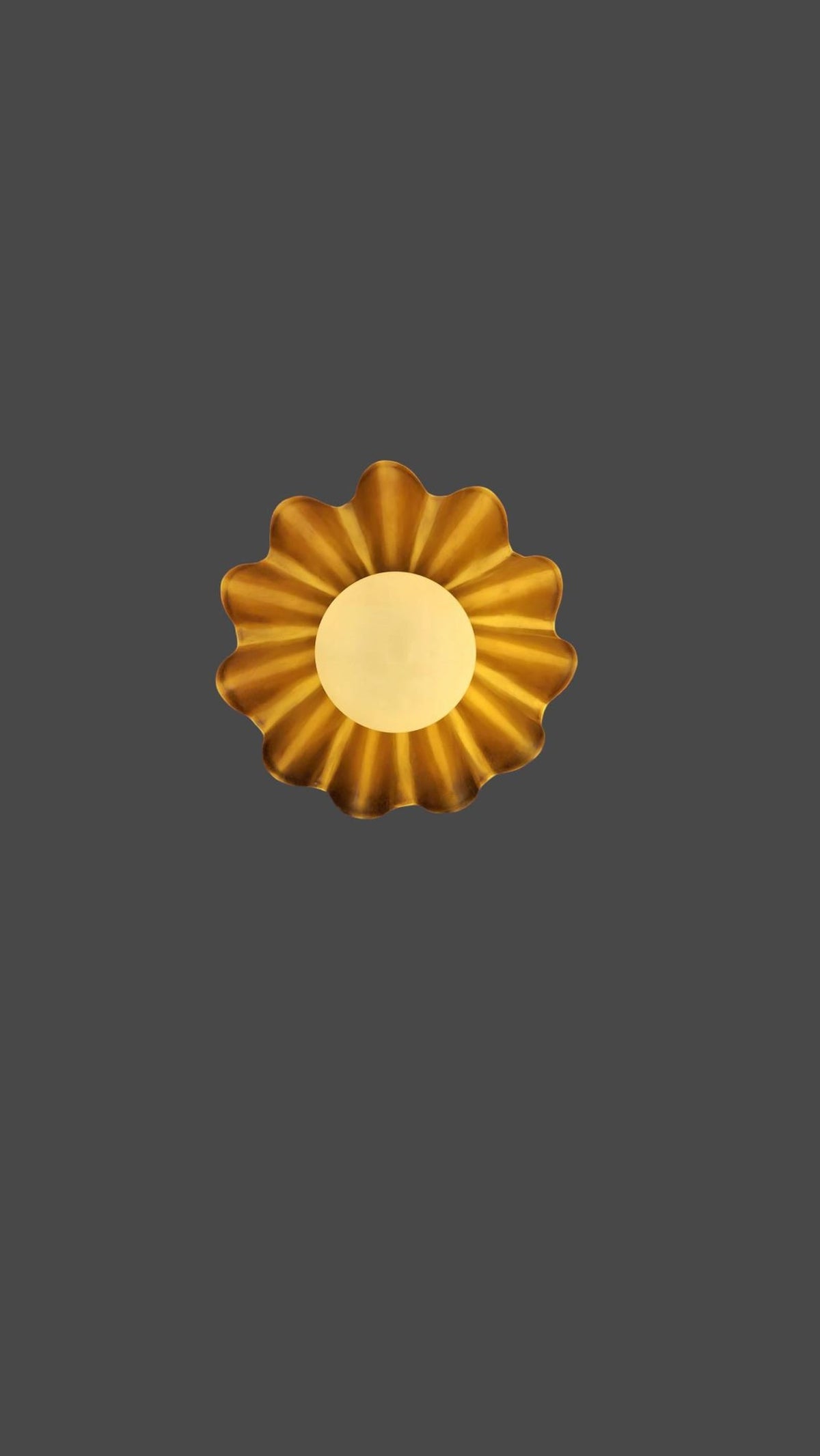 Artistic ruffled brass ceiling light with sculptural shade and soft globe diffuser
