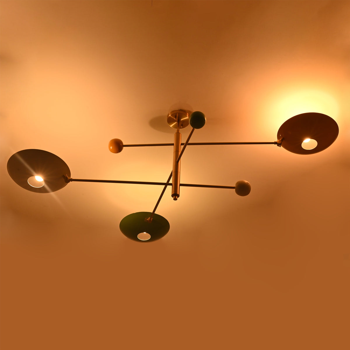 Sculptural brass flush mount ceiling light designed for dramatic indirect ceiling wash lighting