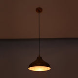 Single solid copper dome pendant with black cord and round copper canopy on a clean white background