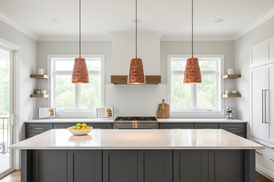 Copper pendant light installed above a dining table with red patterned shade and warm ambient glow for modern interiors