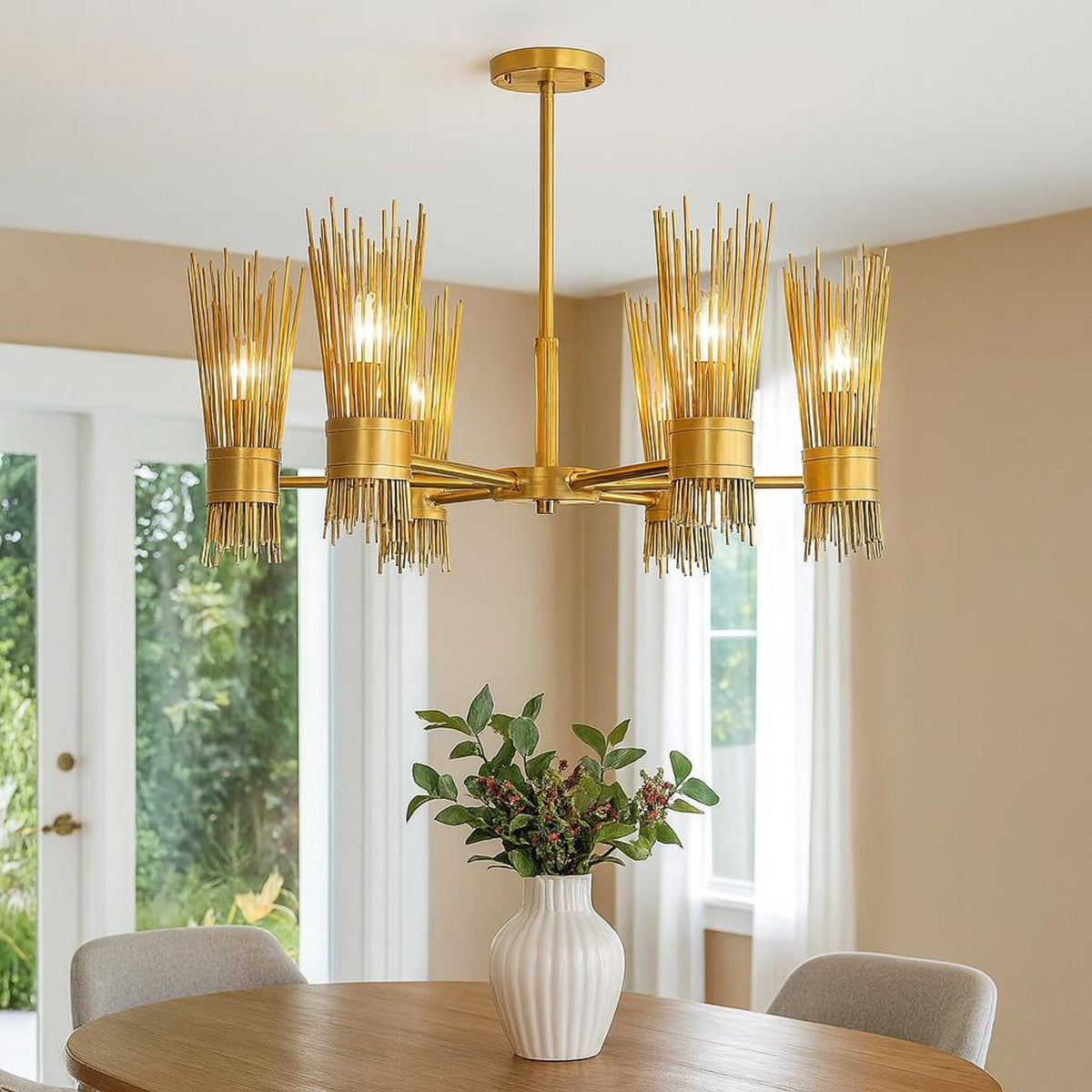 Six light sculpted brass chandelier installed above a dining table, creating warm ambient lighting with modern industrial elegance.