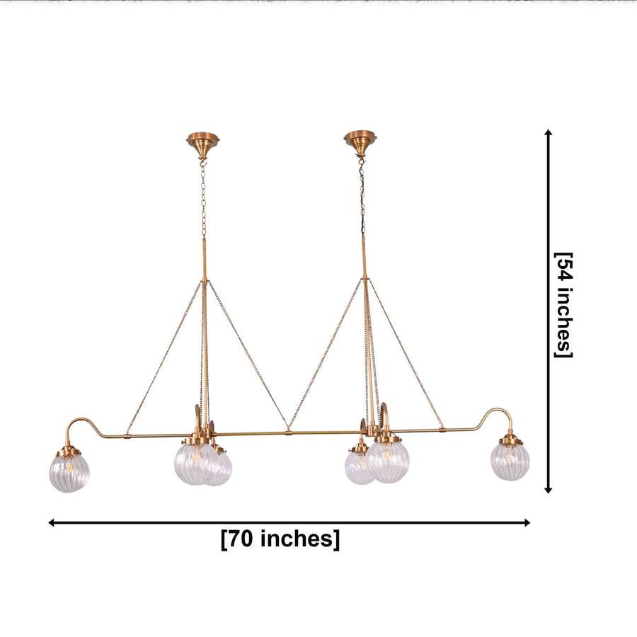 Front view of a long linear ribbed glass globe chandelier designed for dining rooms, kitchen islands, and large interiors