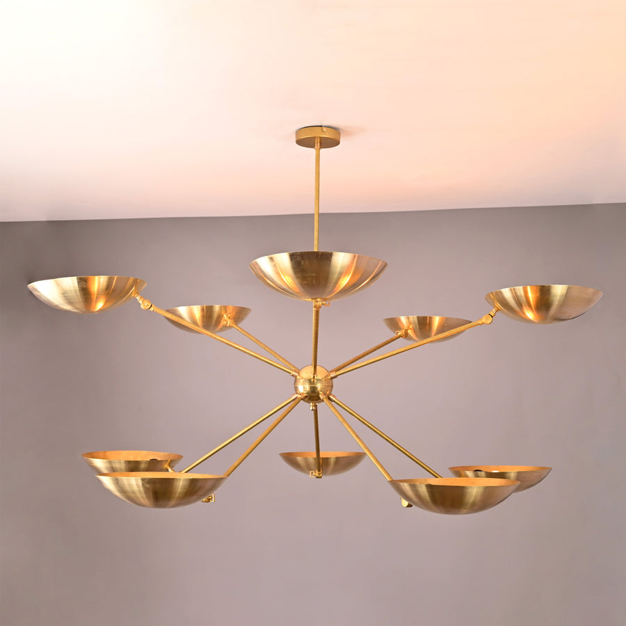 Solid brass 10-light chandelier with elegant bowl-shaped shades and balanced contemporary structure.