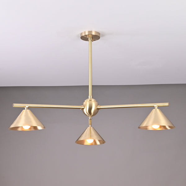 Modern solid brass chandelier with three cone-shaped shades, brushed finish, handcrafted for contemporary interior lighting.
