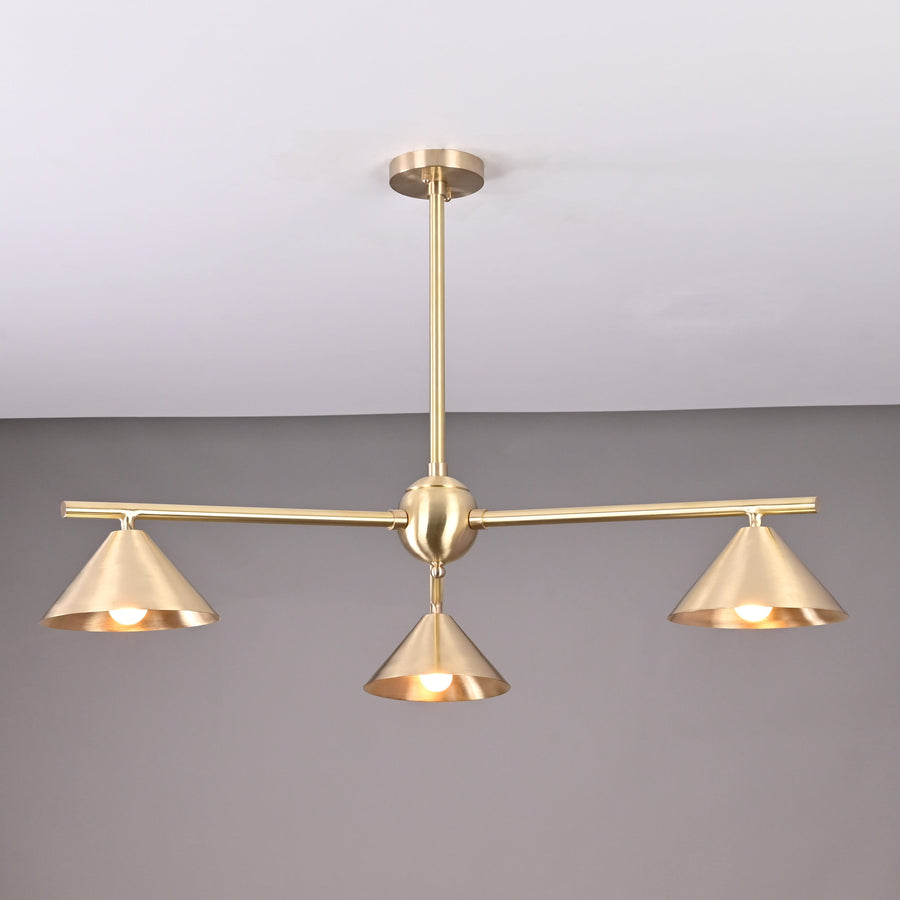 Modern solid brass chandelier with three cone-shaped shades, brushed finish, handcrafted for contemporary interior lighting.